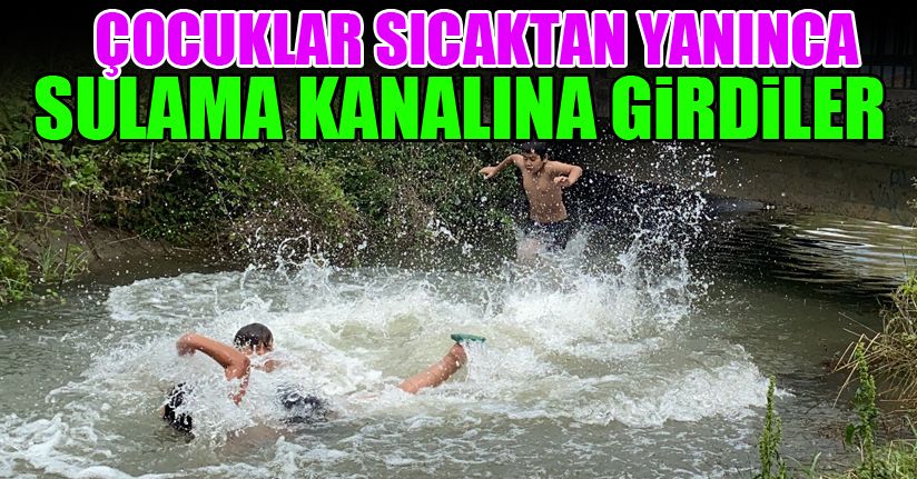 Sıcaktan bunalan çocuklar sulama kanalında serinledi