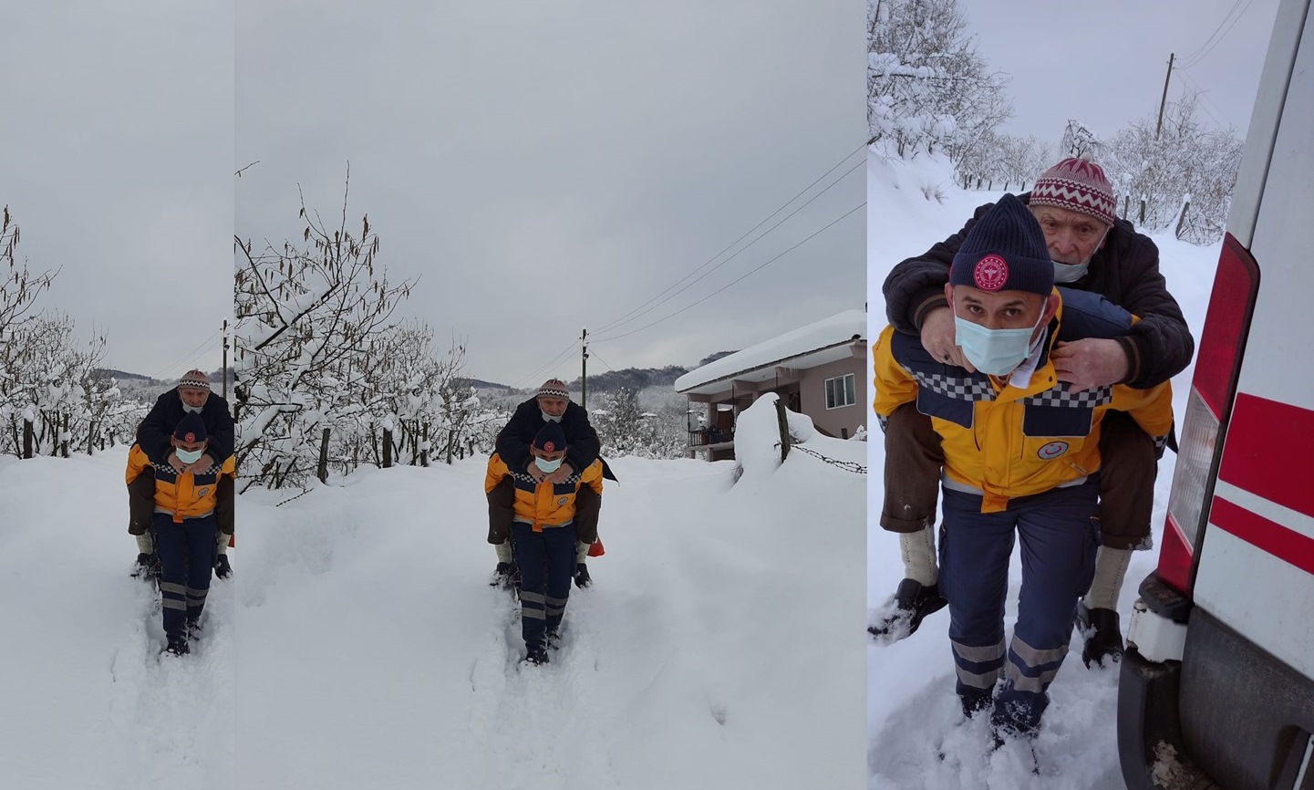 Fedakar sağlık görevlisi hastayı sırtında taşıdı